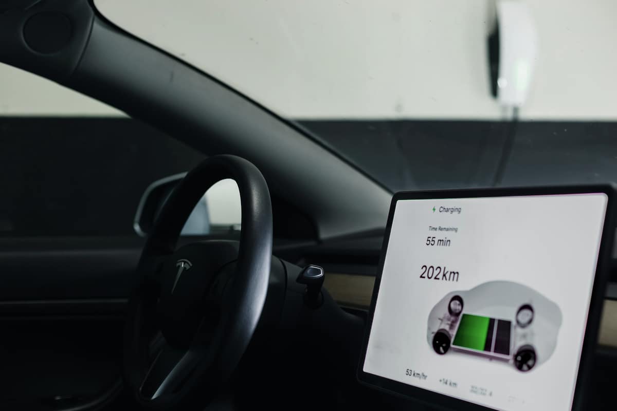 An in-car screen showing the charging status and remaining range of an electric vehicle