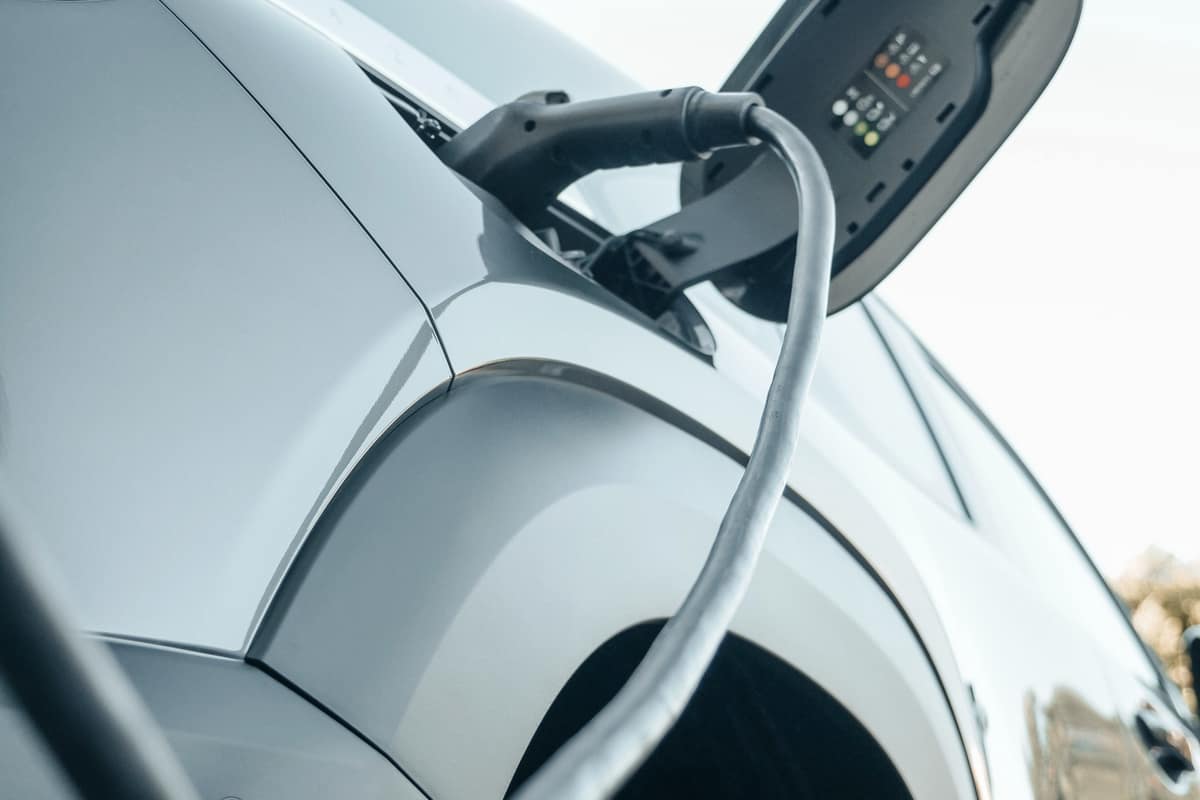 Close-up of an electric car's front wheel and body panels